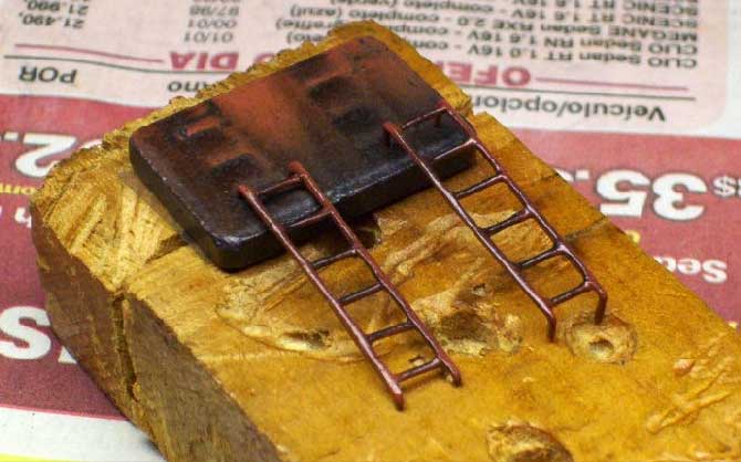 As escadas em miniatura para o ferreomodelo de vagão modificado